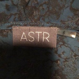 Astr size XS teal and black patterned romper. Gently worn.